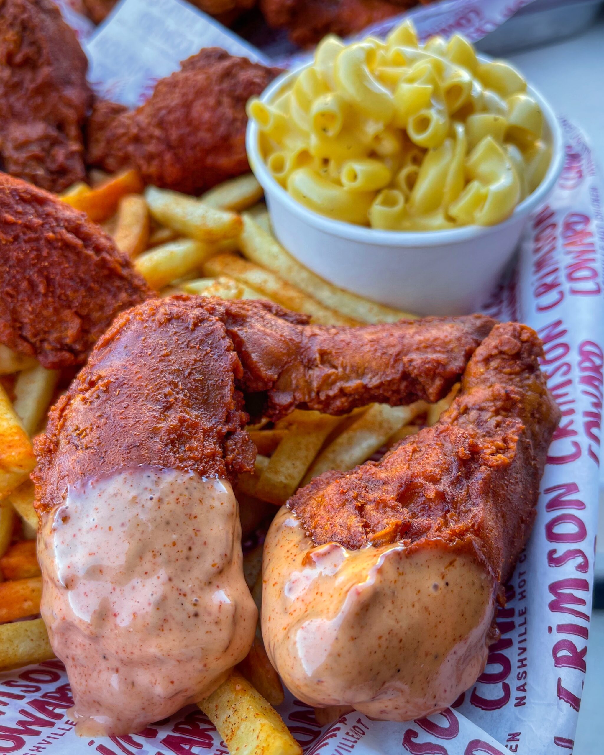 Nashville hot chicken wings with mac and cheese and loaded fries at Crimson Coward